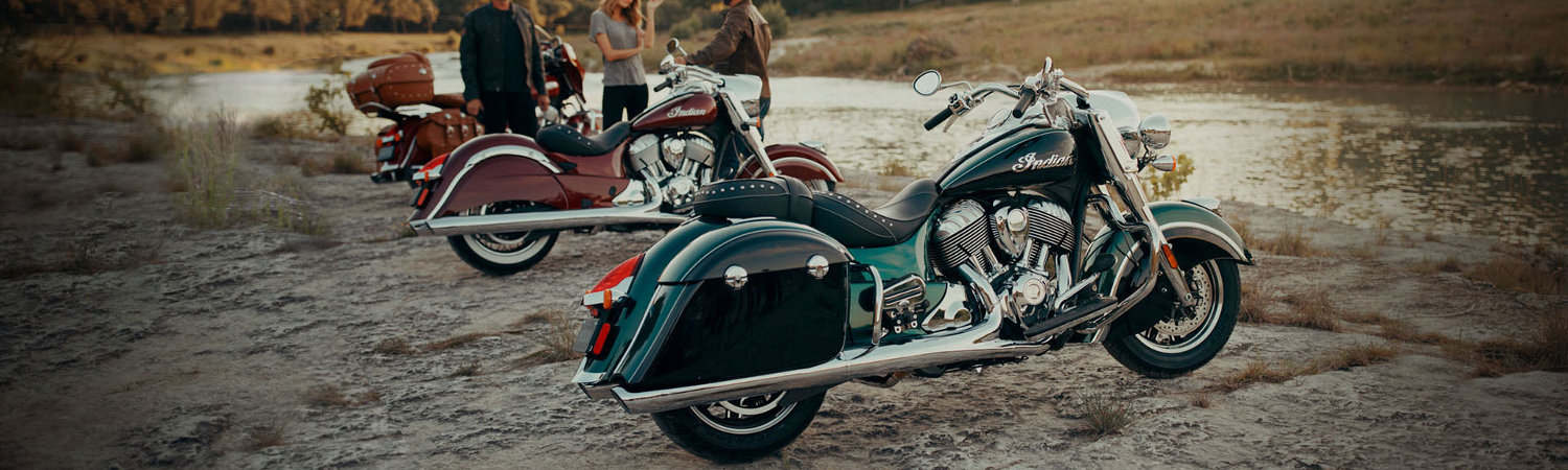 Indian Motorcycle enthusiasts in Tucson, Arizona are chatting by the river with their bikes.